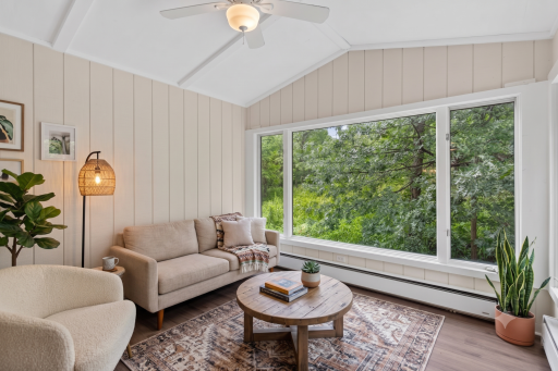 Main level: 3 season porch (virtually staged)
