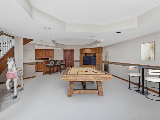 Virtually staged lower level amusement room - The game table will fit!