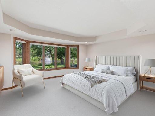 Lower level bedroom #2 is set up perfectly with wonderful backyard views. Virtually staged.