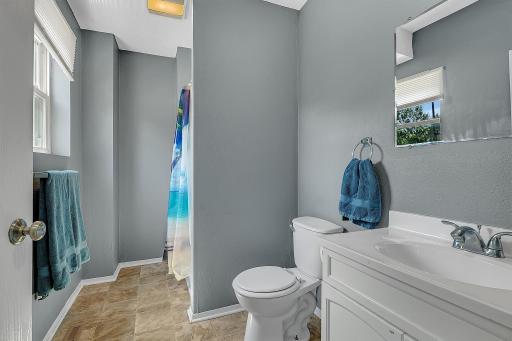This is the main floor 3/4 bathroom immediately to the left of the left front door entrance. Very spacious. It supports the two main level bedrooms.