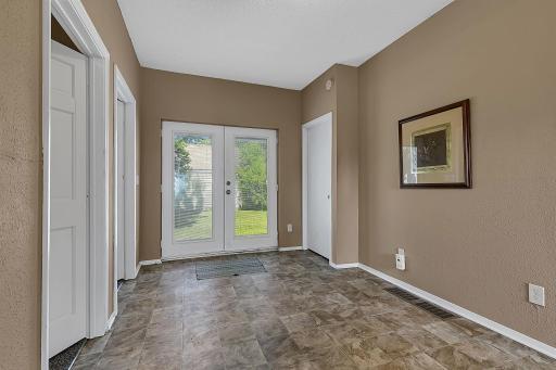 This space could be a main level family room or an informal dining room, depending upon your needs. Double doors lead to the back yard and 3 car garage!