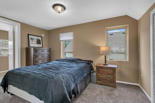 West side upstairs bedroom is nice sized and has a walk-through to the large upstairs 3/4's bathroom. New carpet and blinds.