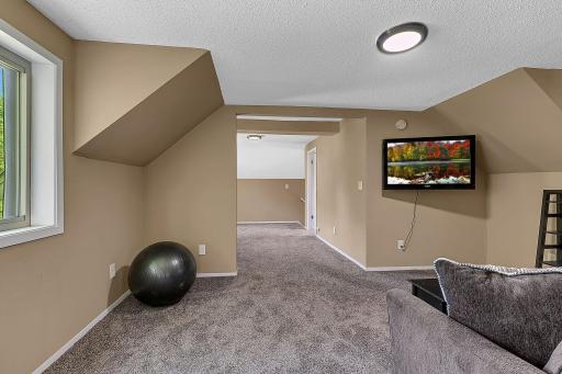 This shot is from the West, upper bedroom door looking back to the stairway to the lower level in the background. New carpeting, new blinds fresh paint throughout the upper level.