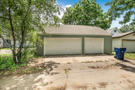 The detached 3 car garage is entered through the alley and a service door on the back leads to the home. The garage is being used as the seller's POD so pardon the "stuff". All be gone by closing. It is deep enough for big trucks.