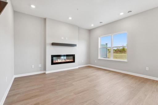 The cozy fireplace creates a beautiful ambiance and heat when needed. Model photo.