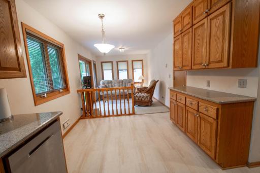 Serving area with cabinets and eat-in dinette just off the sunroom