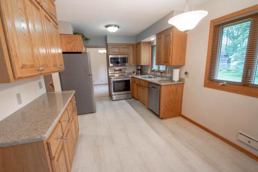 Another view of the eat-in dinette, serving area and cabinets