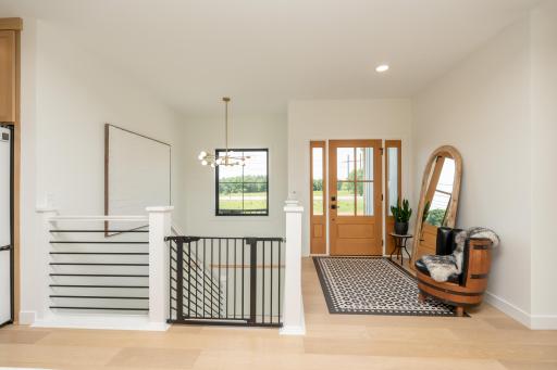 Grand entry with soaring ceilings and modern cable railing