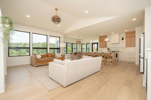 Open-concept living with vaulted ceilings and expansive windows