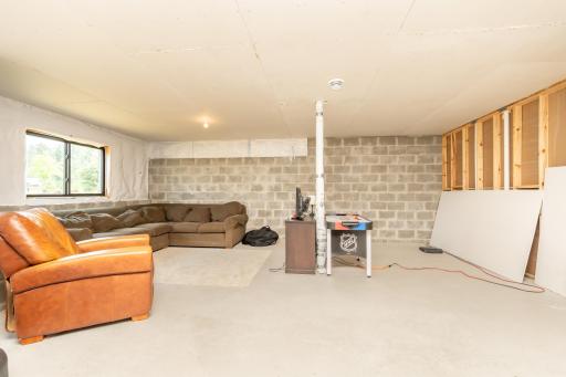 Current recreation space showcases the incredible size and flexibility of the unfinished basement