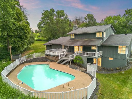 Beautiful inground pool with overlooking deck for enjoyment of hot summer days.