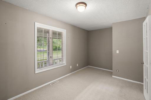 Another view of Home office/Den with natural light and view of front porch.