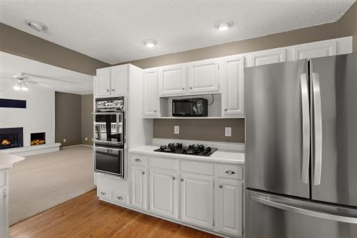 Family room with gas fireplace just off kitchen.