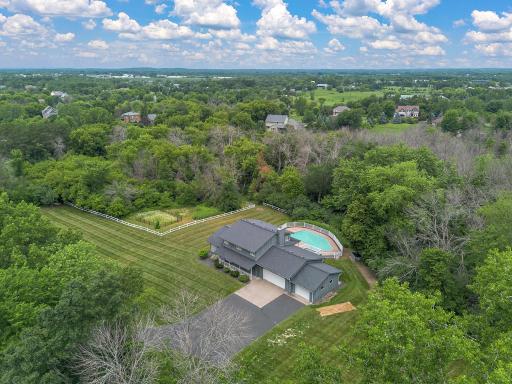 Overview of the home and lot surrounded by trees and privacy.