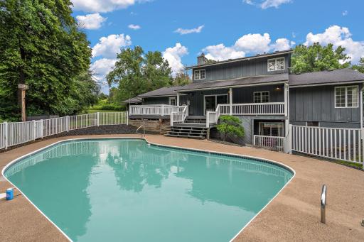 Covered deck and easy access for pool party activities.