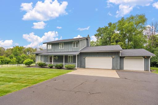 Two story home nestled on 3.36 acre lot with wooded perimeter for privacy.