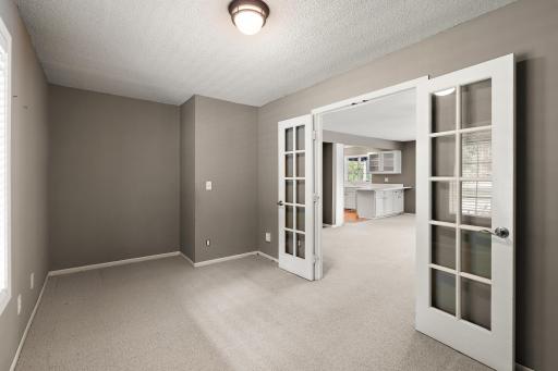 Home office or Den with double French door located off family room.