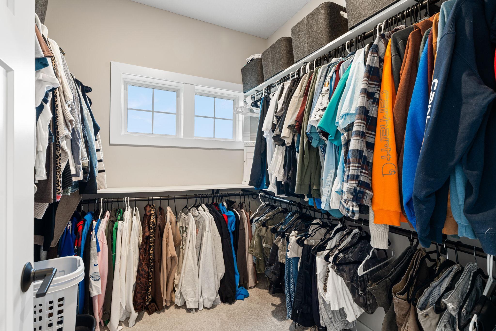 Primary bedroom walk in closet.