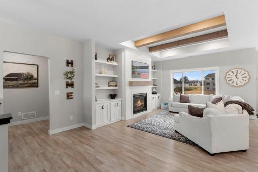View into living room from front door entrance near staircase.