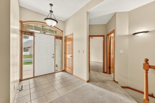 Entry-way, main level bath and East bedroom.