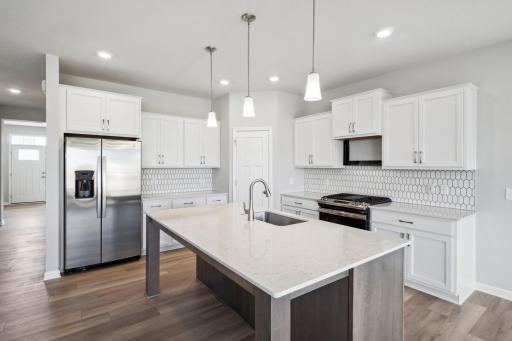 Kitchen. Photo is a completed home for illustrative purposes. Personalize this home with your chosen finishes.