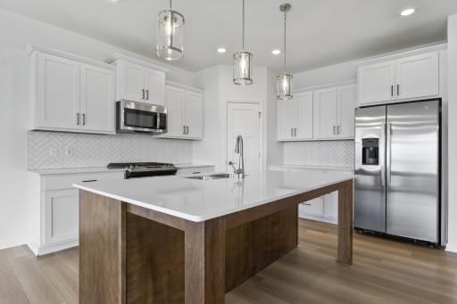 Kitchen of the Grayson. Photo is a completed home for illustrative purposes. Personalize this home with your chosen finishes.