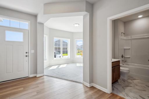 Entryway looking towards den. Photo is a completed home for illustrative purposes. Personalize this home with your chosen finishes.