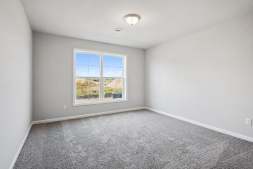 Secondary bedroom. Photo is a completed home for illustrative purposes. Personalize this home with your chosen finishes.