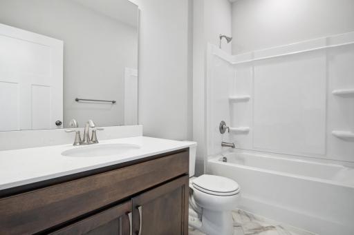 Main bathroom. Photo is a completed home for illustrative purposes. Personalize this home with your chosen finishes.