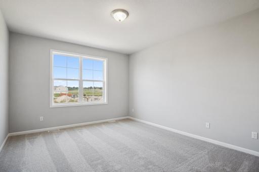 Owner's bedroom. Photo is a completed home for illustrative purposes. Personalize this home with your chosen finishes.