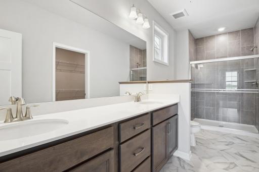 Owner's bathroom. Photo is a completed home for illustrative purposes. Personalize this home with your chosen finishes.