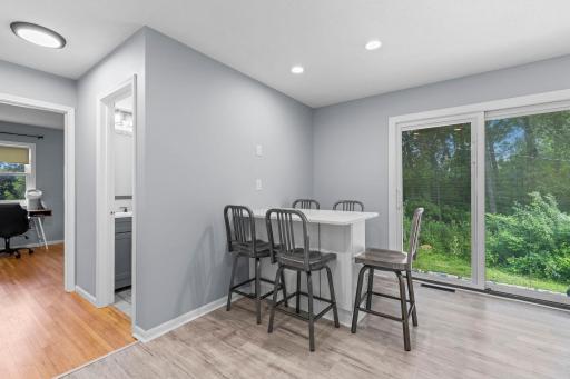 Dining area is also connected to the outdoors through sliding patio doors