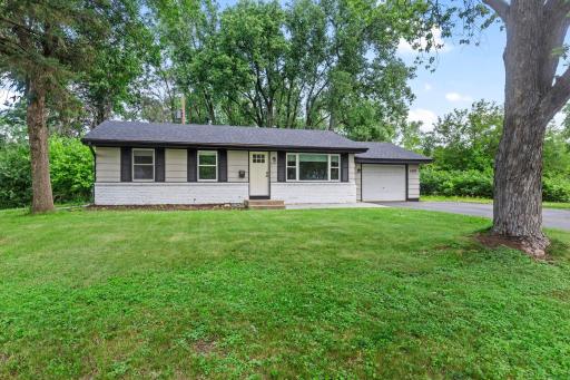 Wonderful home tucked away on a lot surrounded by trees, yet with easy access to city amenities