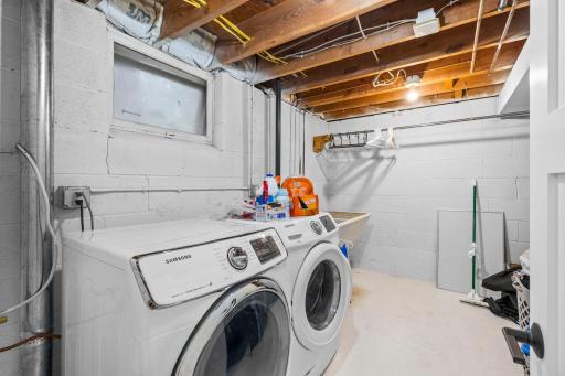 Lower level laundry room with utility sink