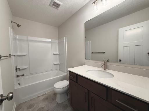 A full bath conveniently serves the secondary bedrooms.