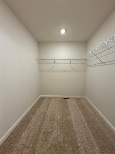 Generous walk-in closet makes organization easy.