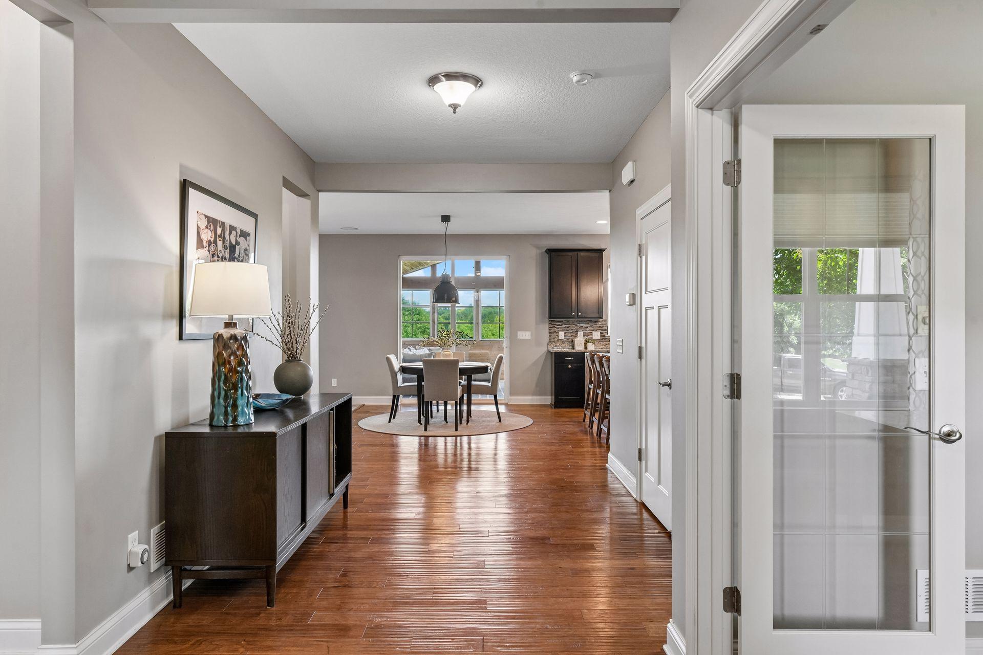 As you enter the home you are greeted with wide hallways and views directly out to private backyard