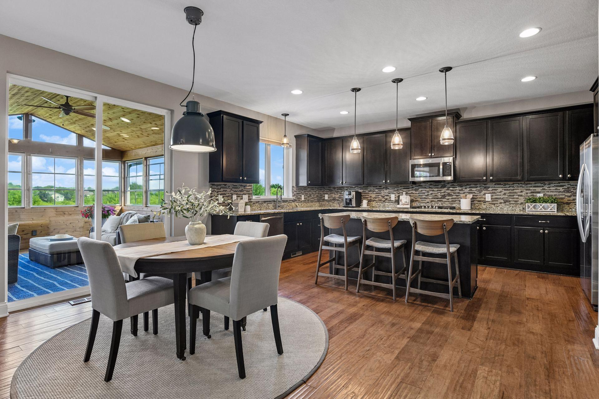 Directly from dining room and kitchen is slider door access out to three season sunroom