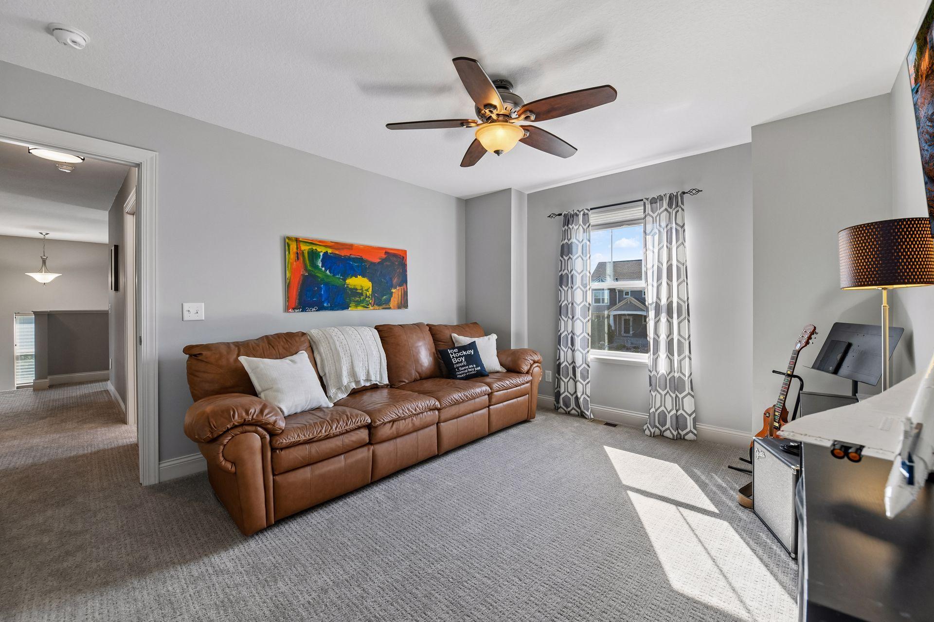 Third bedroom on the upper level currently being used as a living room space