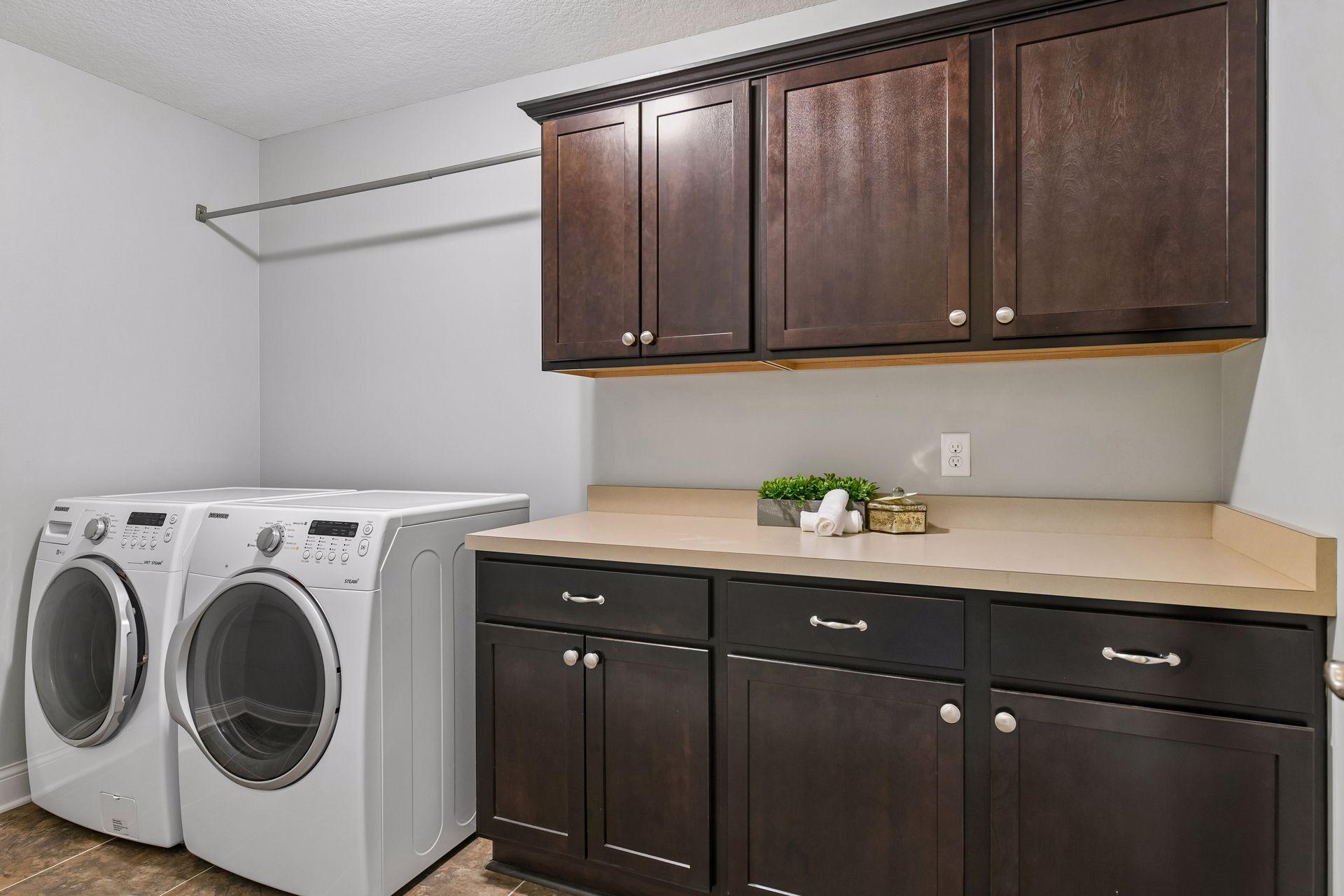 Large laundry room with ample cabinet space