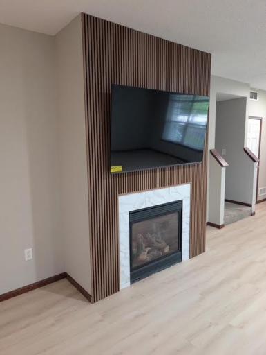 New fireplace front w/75" TV