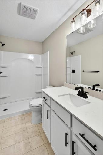 Private Primary Bathroom. Photo taken of another home with similar plan and finishes.