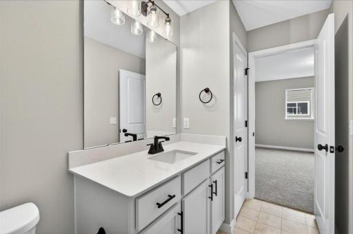 Private Primary Bathroom. Photo taken of another home with similar plan and finishes.