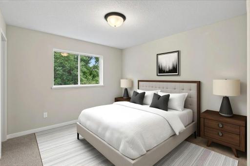 Bedroom 2, Virtually Staged. Photo taken of another home with similar plan and finishes.