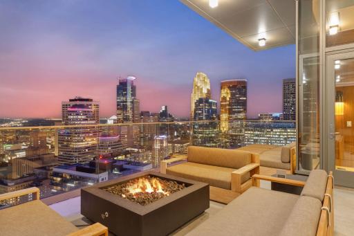 One of two large covered patios over looking the Minneapolis skyline , US Bank Stadium and the winding Mississippi River.