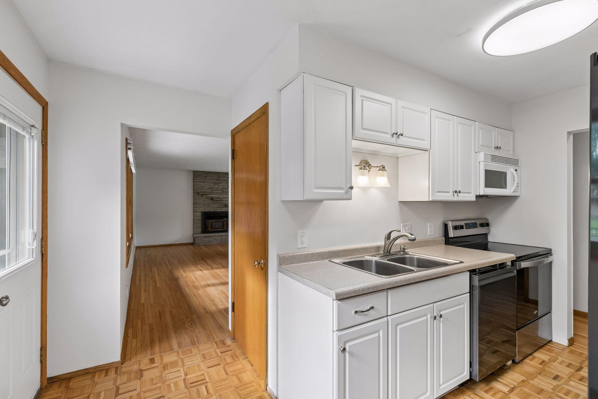 Kitchen leads out to backyard patio--perfect for summertime grilling!