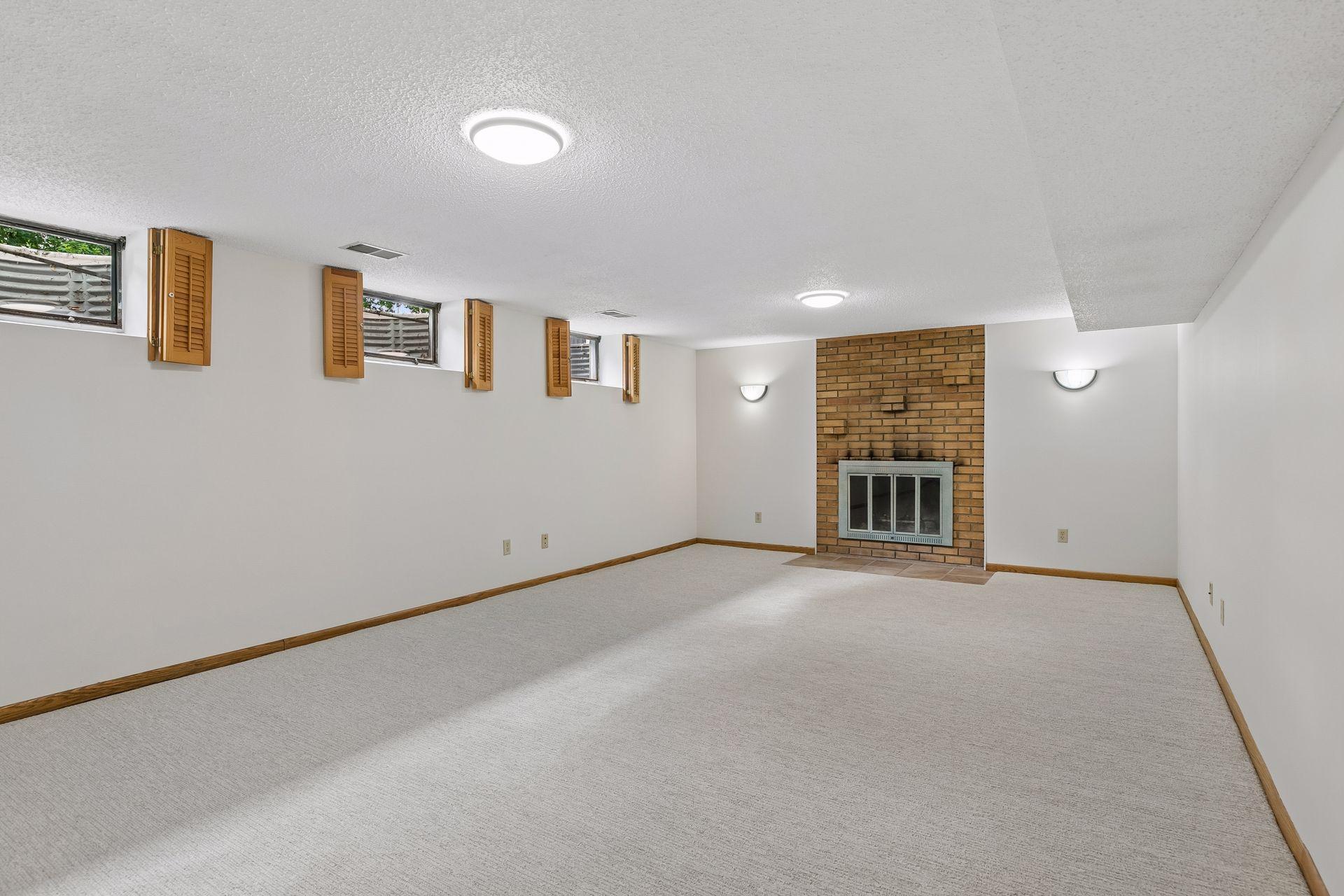 Family room in lower level with new carpet and fresh paint