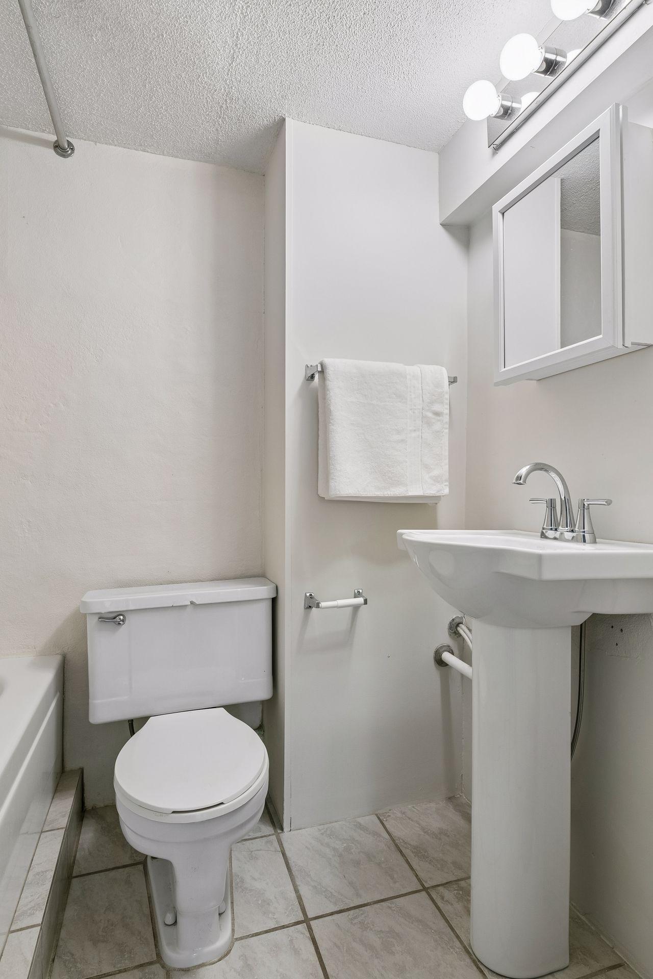 Lower level bath has a shower tub too!