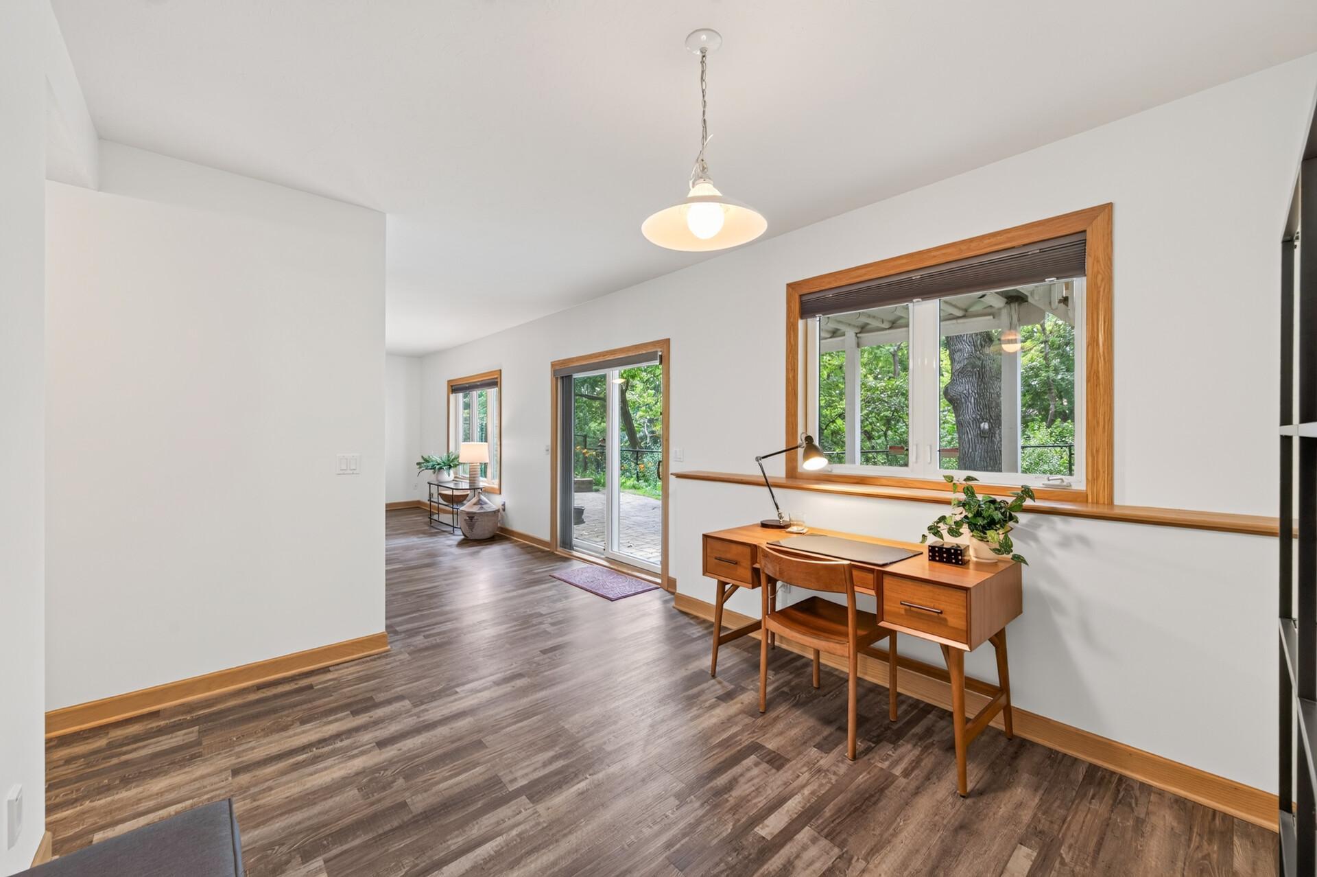 Walk-out basement with 4 separate areas in back and additional kitchen and dining room in front.