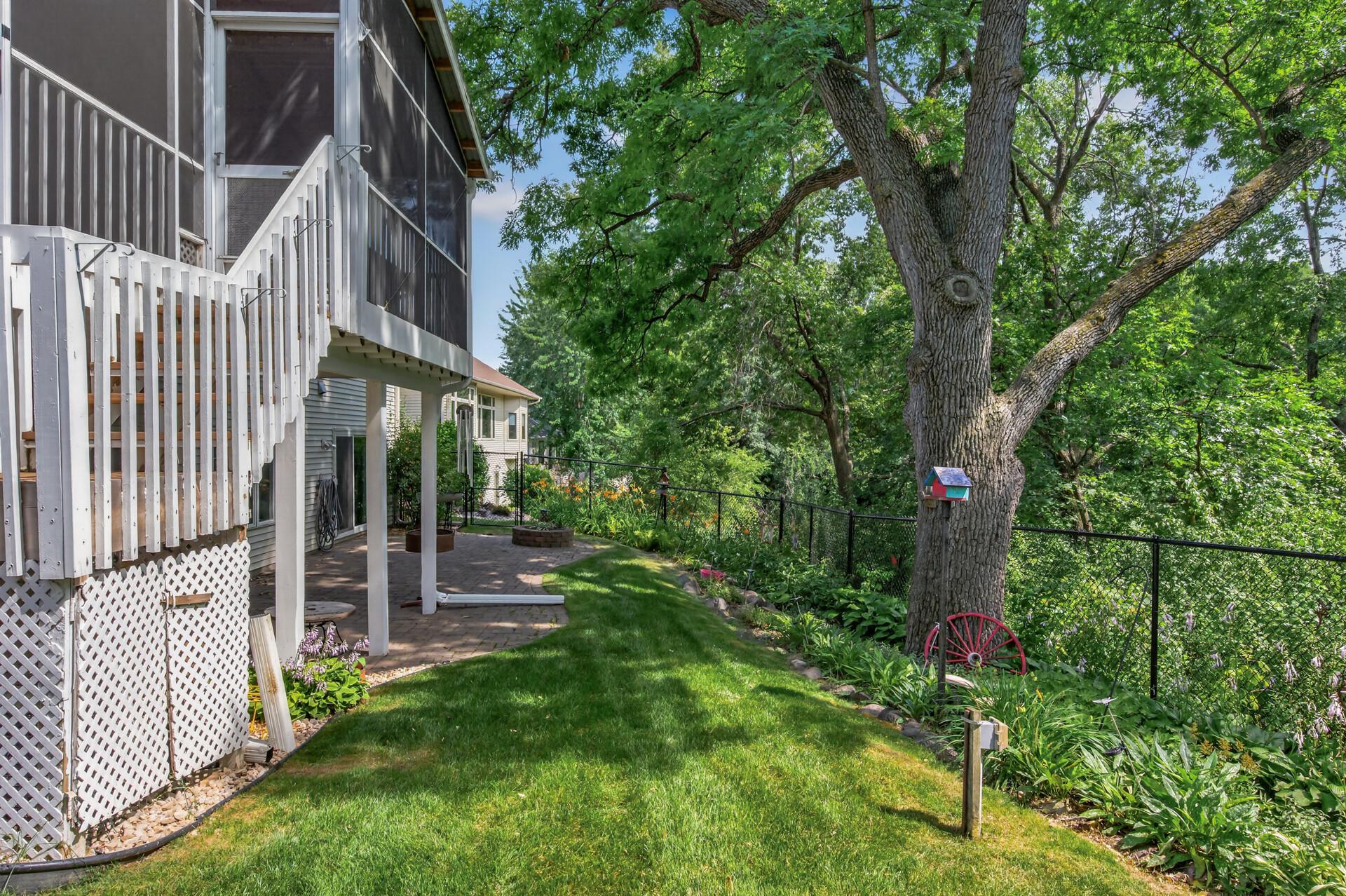 Backyard overlooking wooded area and pond.